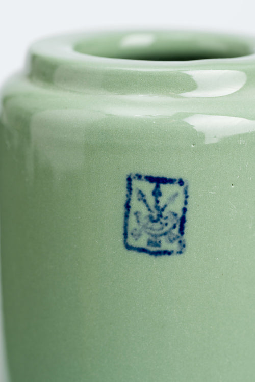 Green ceramic vase with a blue logo on a white background