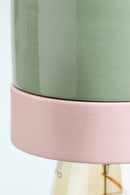 Green and pink cylindrical object on a white background