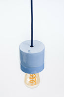 Light blue pendant lamp with a visible brand logo on a white background