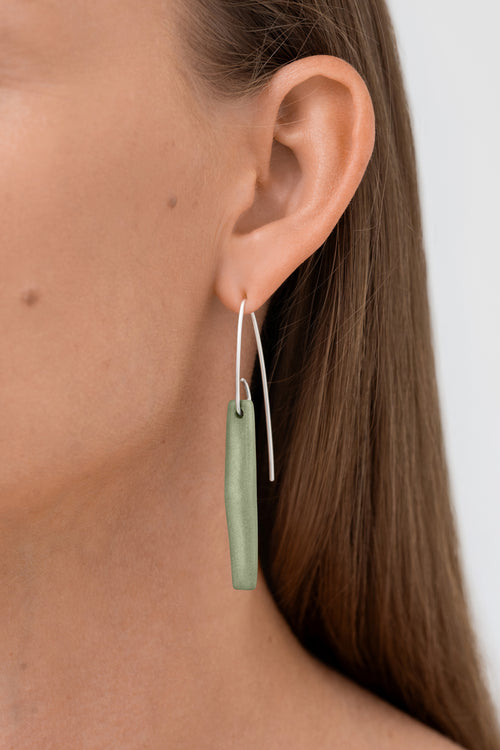 Matt green porcelain statement earring with custom 925 sterling silver. Handcrafted by IAC member Márton Strohner. Limited series, made to order. STUDIO MASTRO