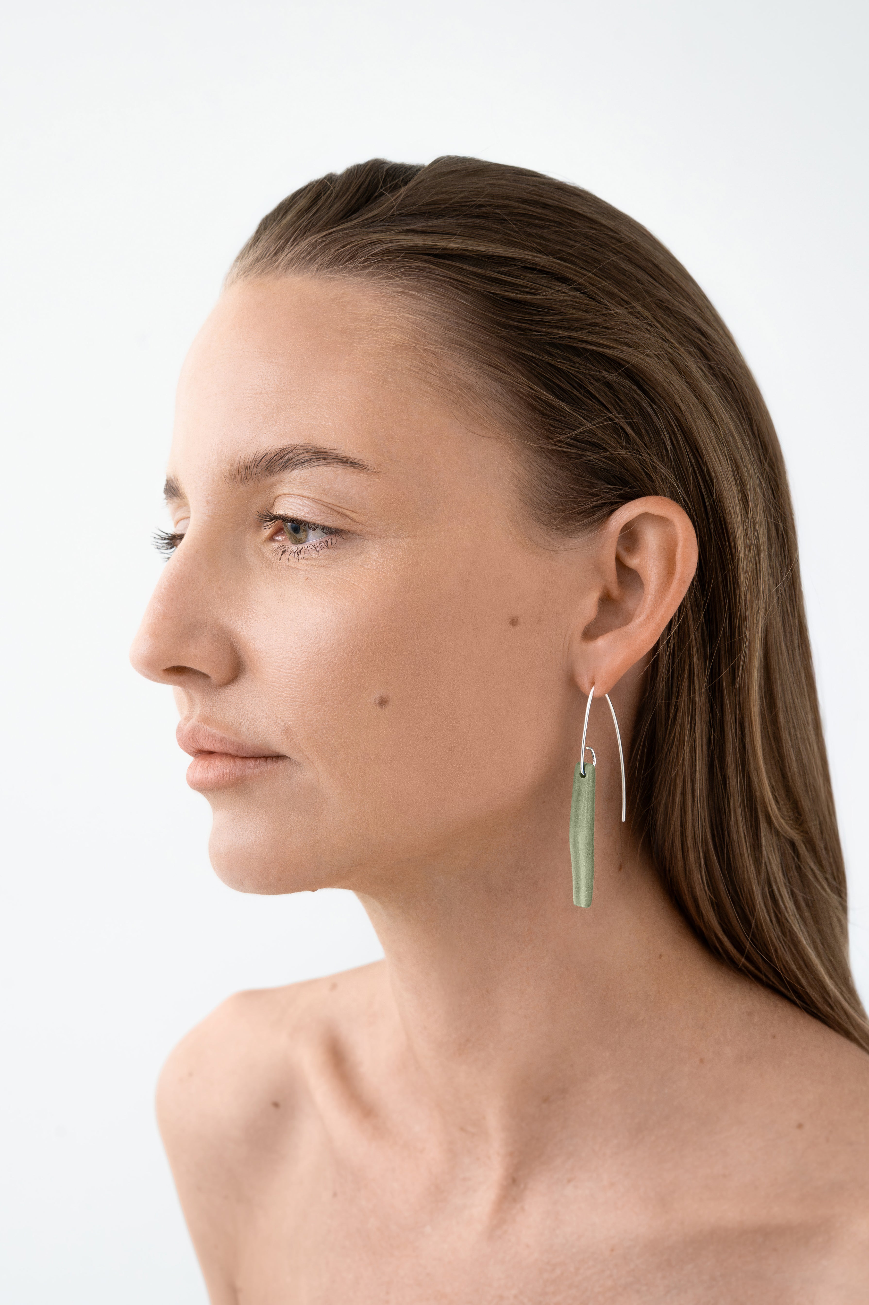 Matt green porcelain statement earring with custom 925 sterling silver. Handcrafted by IAC member Márton Strohner. Limited series, made to order. STUDIO MASTRO
